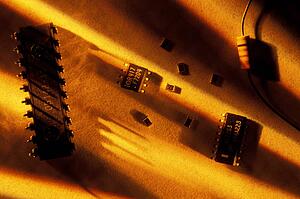 Computer parts in sand