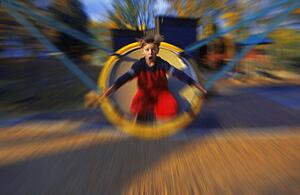 Young boy on playground ride