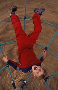 Young boy on playground ride