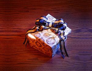Present with blue and gold bow