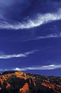 Bands of cloud above rocky desert terrain