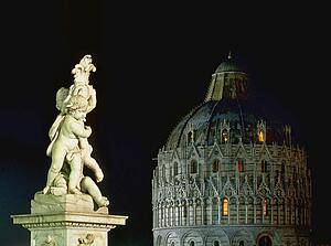 Statue near cathedral at night