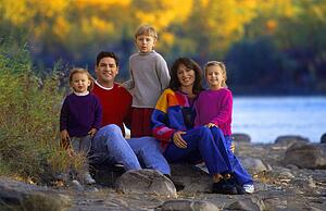 Family portrait by riverside