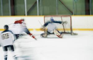 Ice hockey goalie making save
