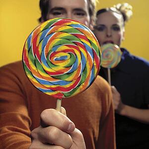 Couple with lollipops