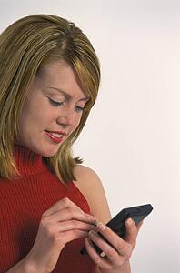 Young woman using PDA