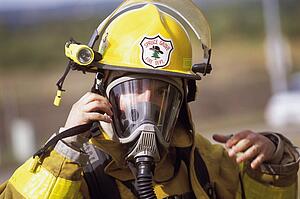 Fireman adjusting mask