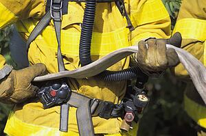Fireman holding empty hose