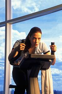 Woman on exercise bicycle