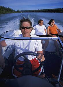 People on speedboat from bow of boat