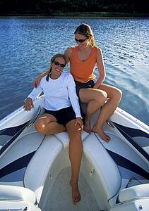 Women sit on a boat