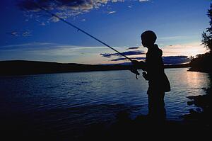 Boy fishing in river