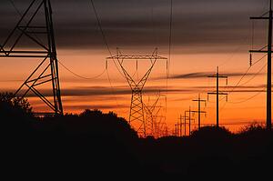 Sunset by parallel power lines