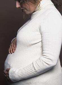 Pregnant woman stroking belly