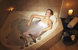 Woman relaxing in hot tub