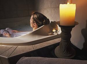 Woman relaxing in hot tub