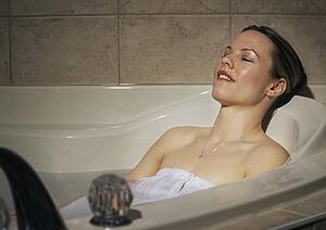 Woman relaxing in hot tub