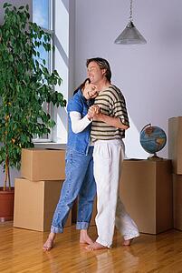 Couple dancing in new home