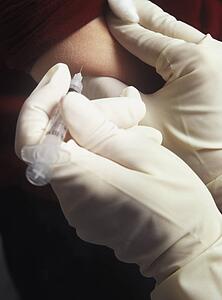 Patient receiving injection in arm