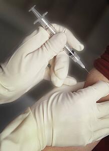 Patient receiving injection in arm