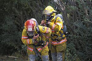Firemen putting on equipment