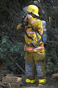 Fireman putting on equipment