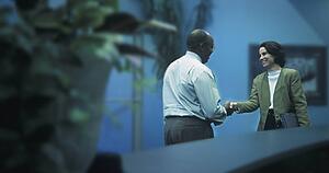 Man and woman shaking hands