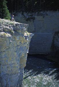 Cyclist looking over cliff
