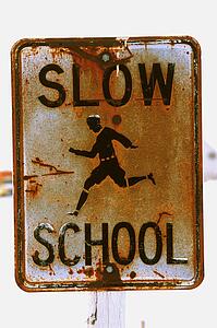 Rusty school zone sign
