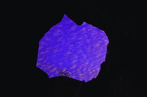 Bicycle at mouth of cave