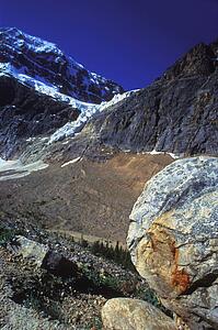 Mountain side with large boulders and snow