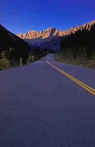Two lane highway in narrow mountain valley