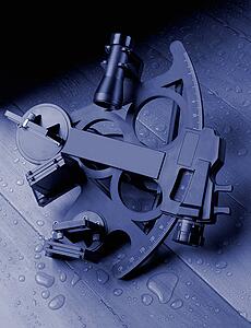 Sextant on wooden deck