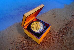 Compass in a box on the beach