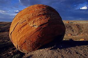 Large red boulder in desert valley Red Rock Coulee Alberta