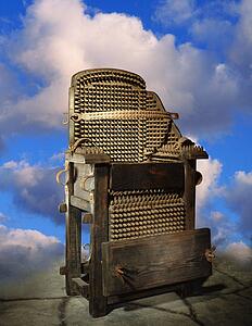 Electric chair against a background of clouds