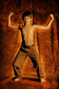 Boy flexing his muscles