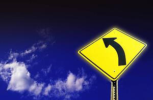 Yellow left turn sign