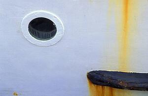 Porthole on white boat