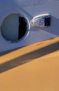 Porthole and marker light on boat