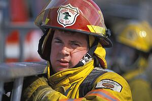 Fireman carrying ladder