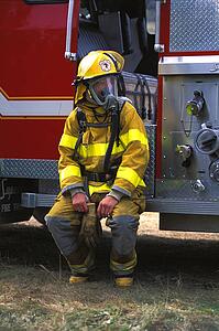 Fireman sitting on fire truck