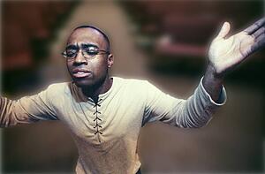 Man with hands raised in worship
