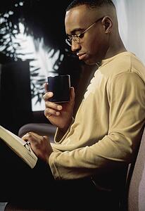 Man reading on couch