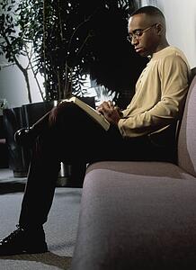 Man reading on couch
