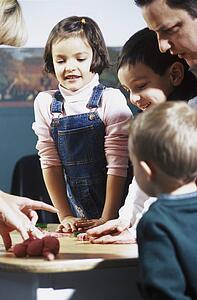 Group of people playing with playdoh