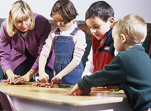 Children playing with supervisor