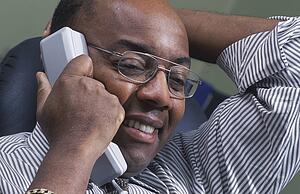 Businessman pleased on phone