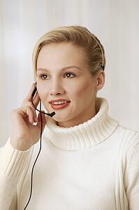 Woman wearing telephone headset