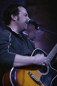 Man playing guitar and singing